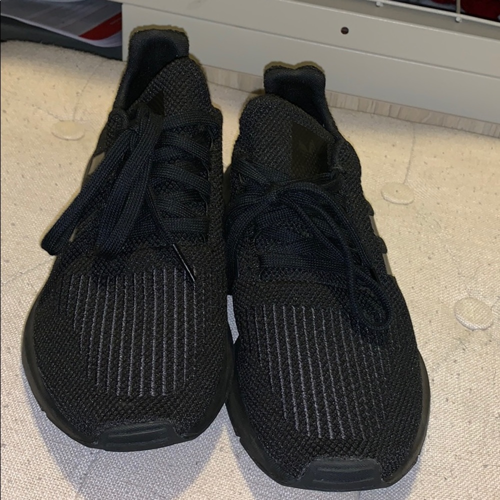 Black adidas running shoes